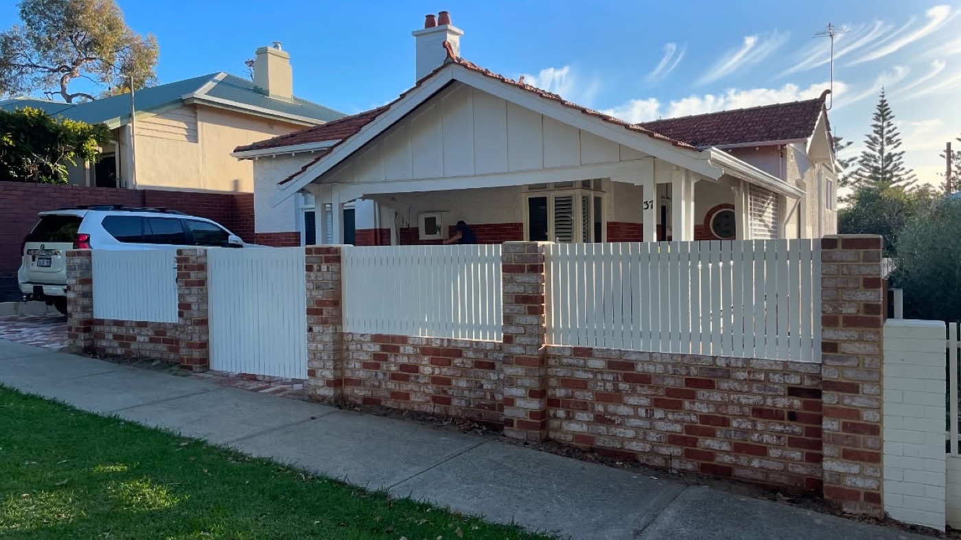 Brick and picket front fence by Westsite Build Co.