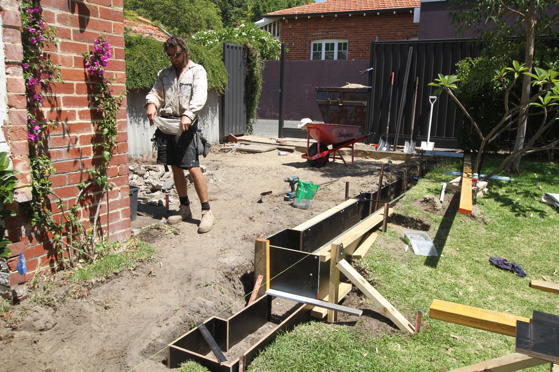 Same site during construction, footings and steel frame being installed
